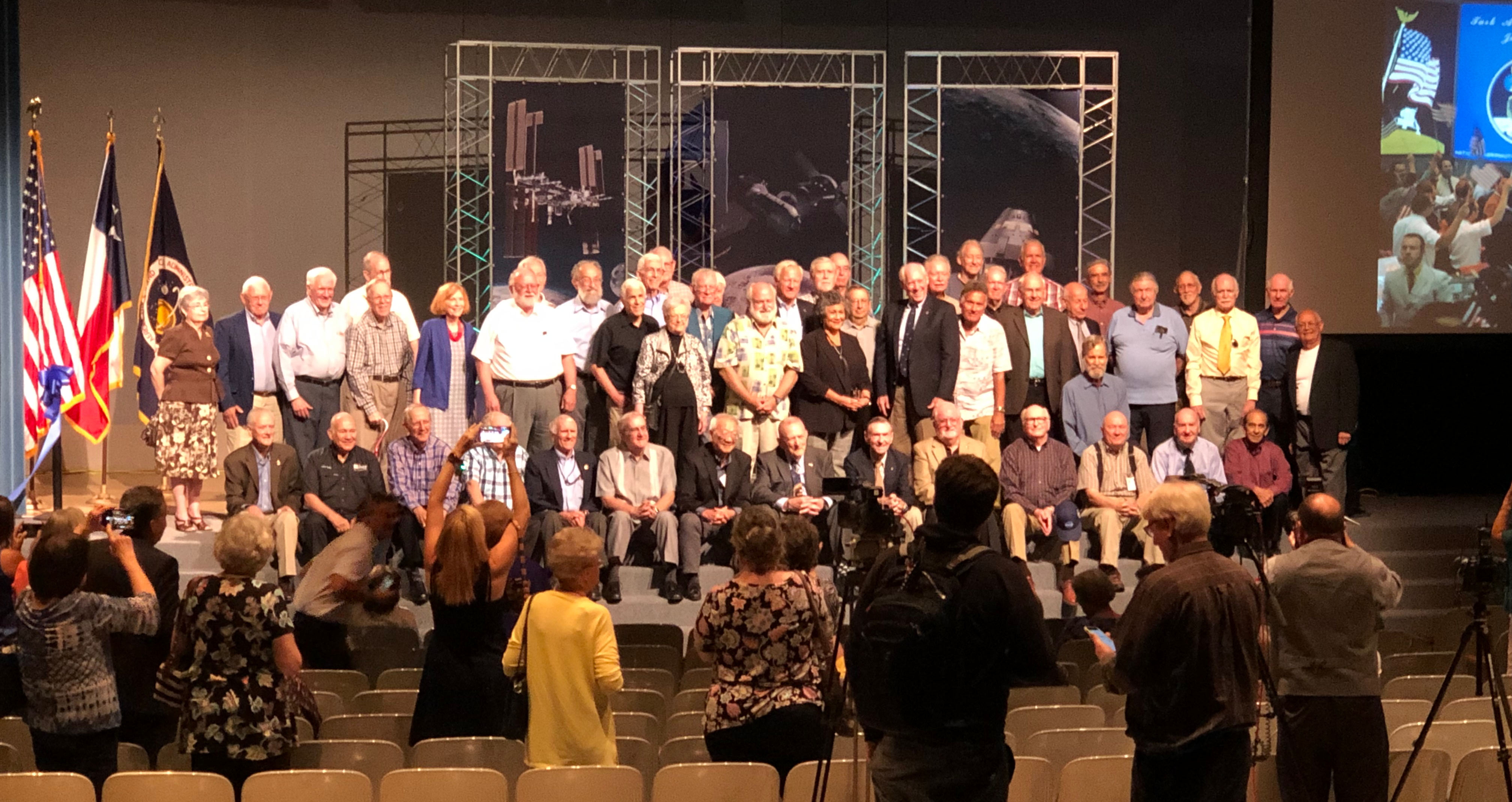 The people who worked in mission control during Apollo, gathered for the reopening